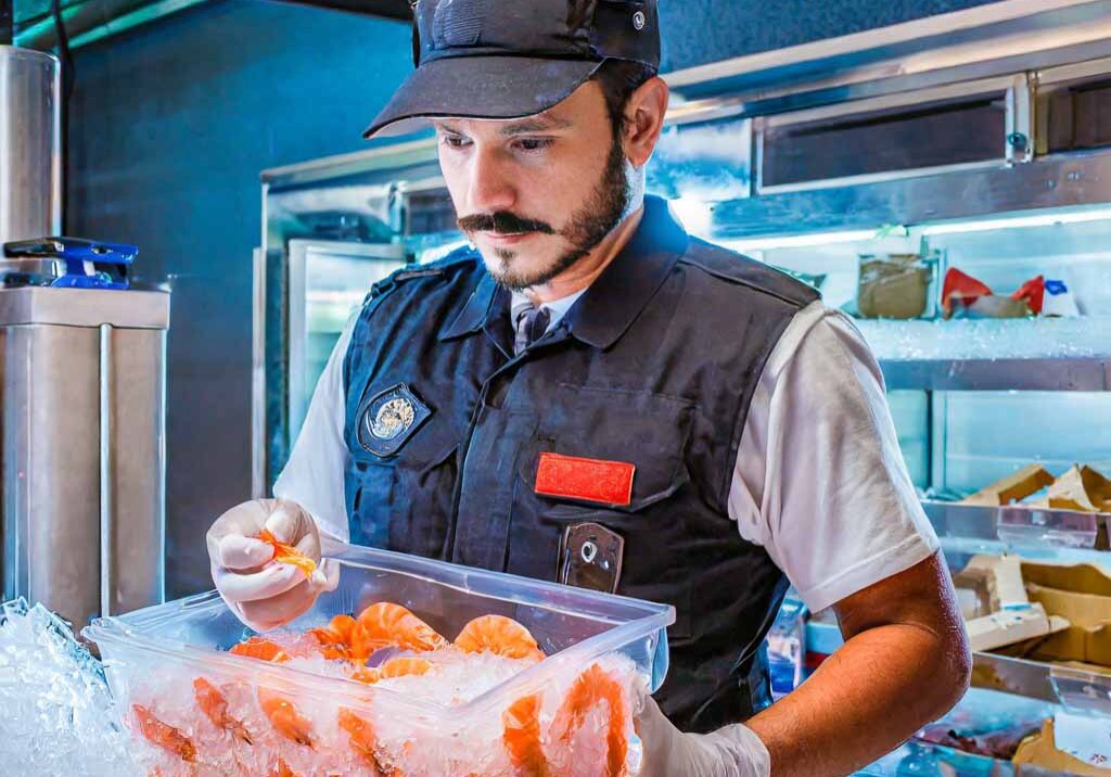 Firefly an image of a law enforcement officer inspecting a box of shrimp packed in ice. The officer